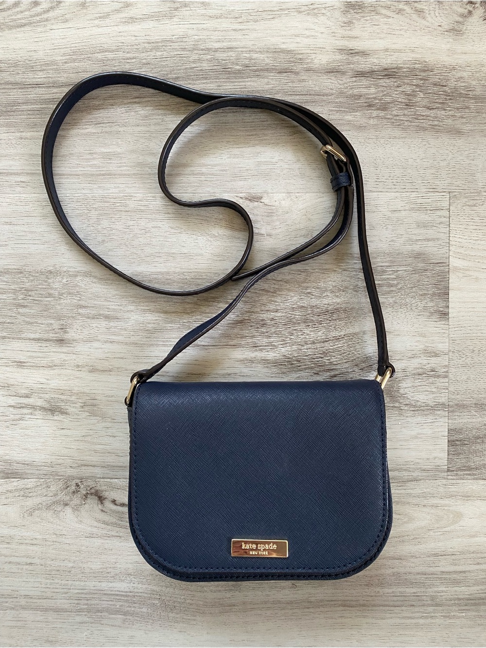 kate spade navy crossbody with gold hardware